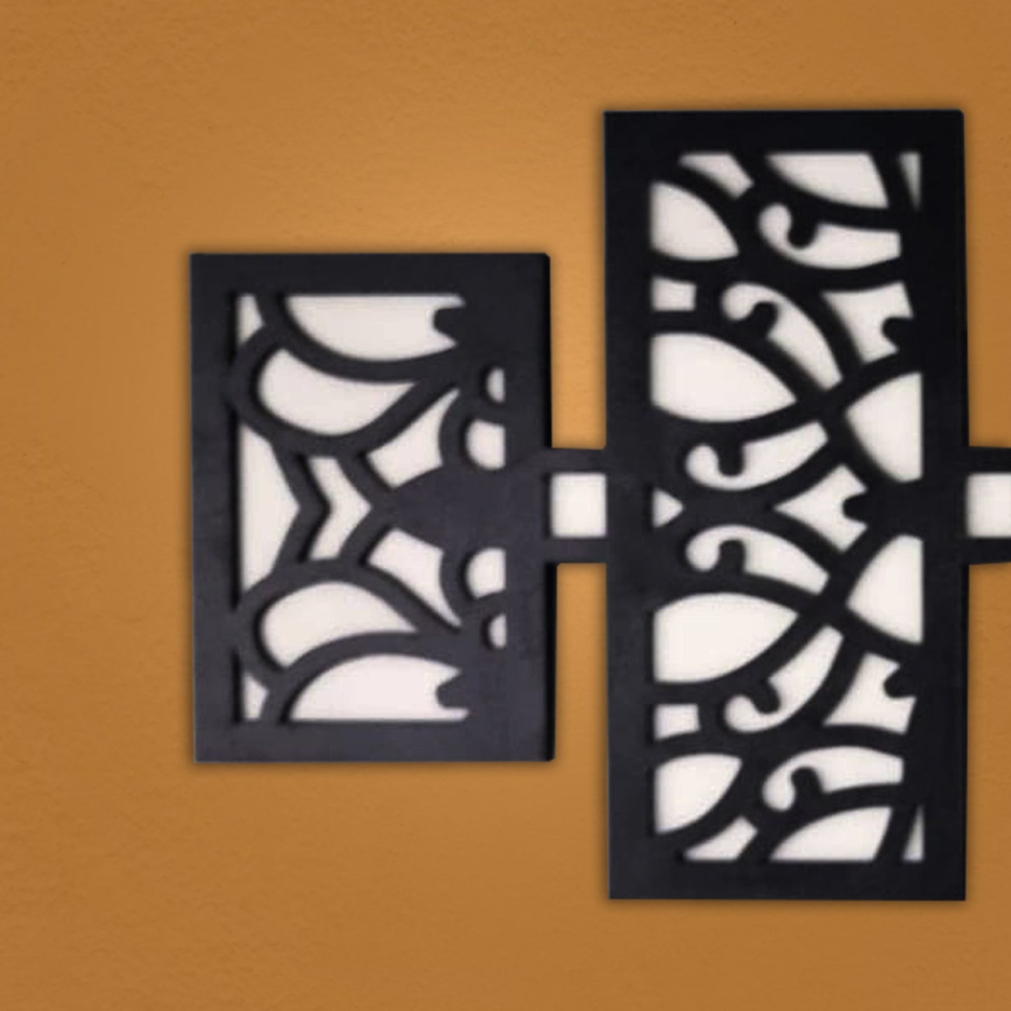 modern wooden wall art panel set – laser cut floral pattern displayed above a modern sofa in a stylish living room.